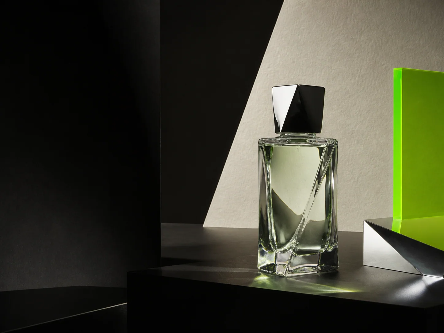 AI-generated fragrance campaign image with a glass bottle, black set, and acid-green acrylic